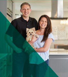 Owners of Highmark Construction holding a small dog